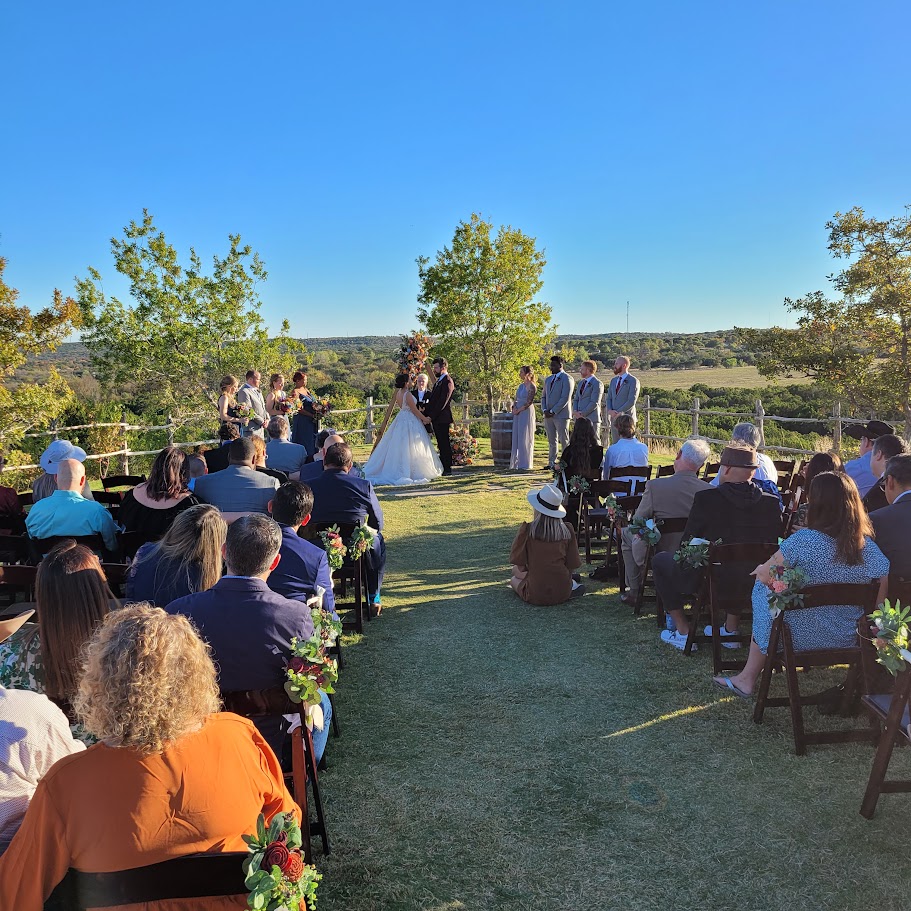 outdoor wedding with hills in the background