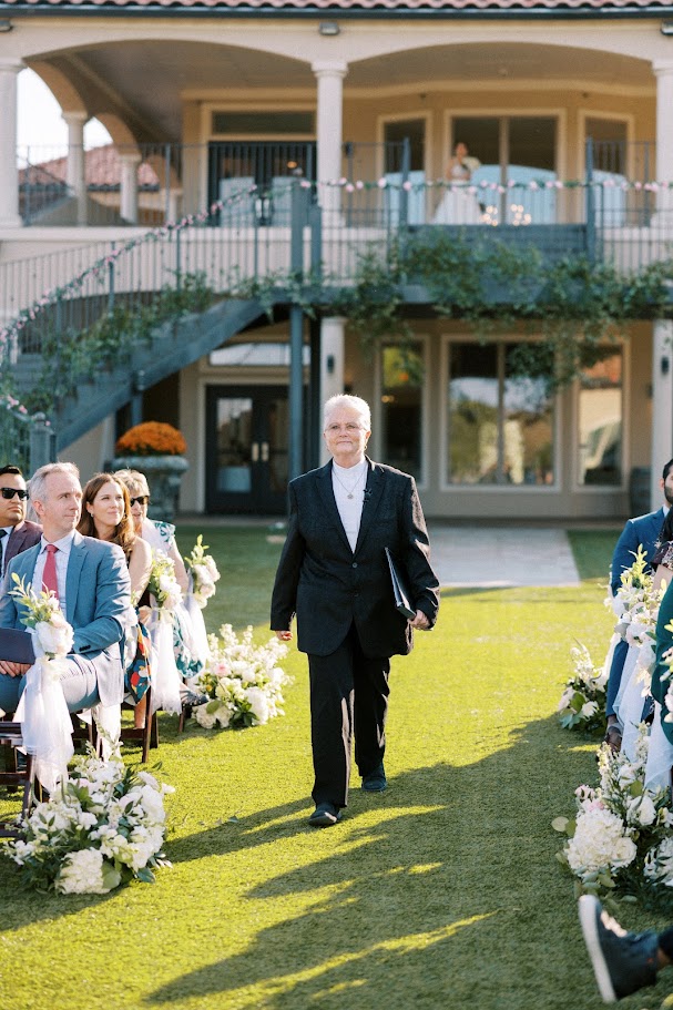 wedding officiant walking to altar