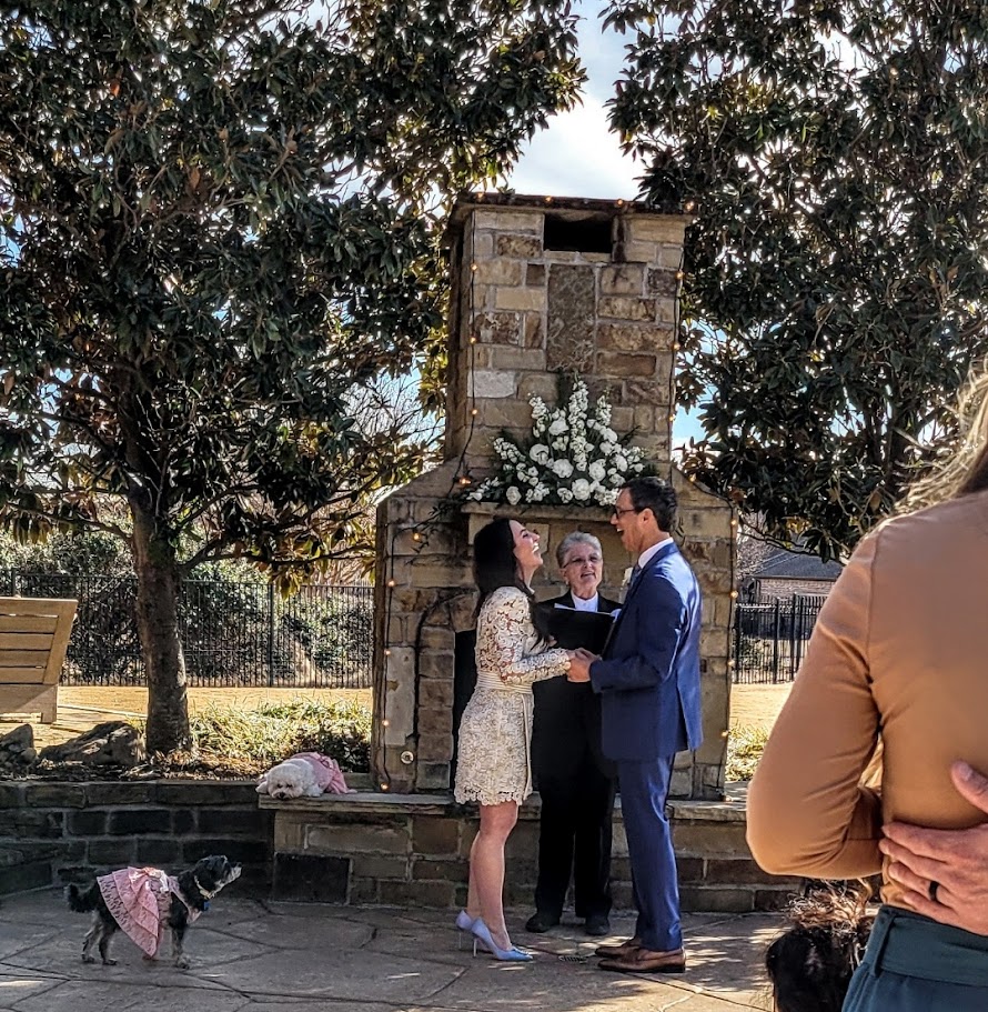 bride and groom laughing during wedding ceremony
