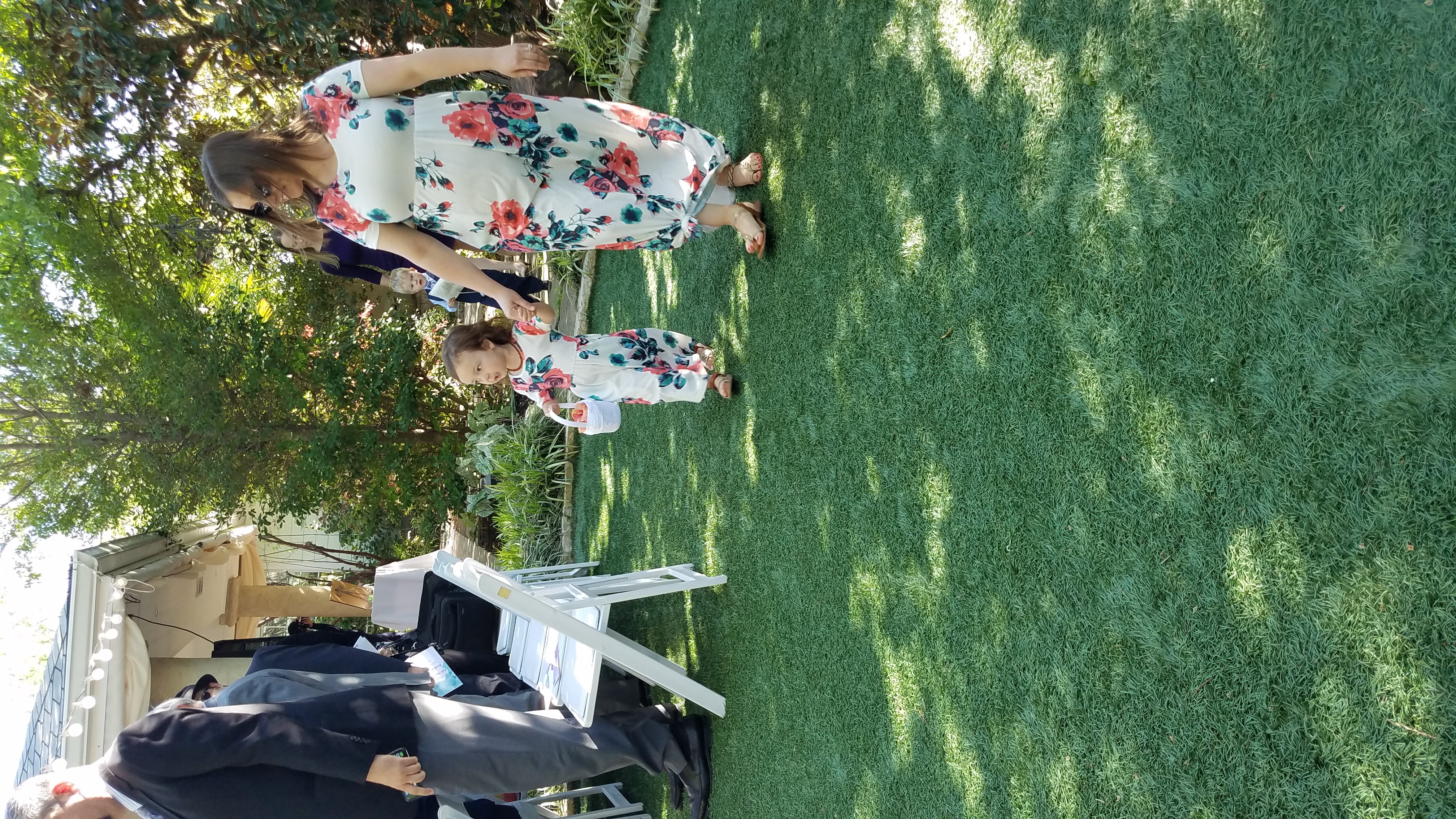 flower girl in colorful floral dress