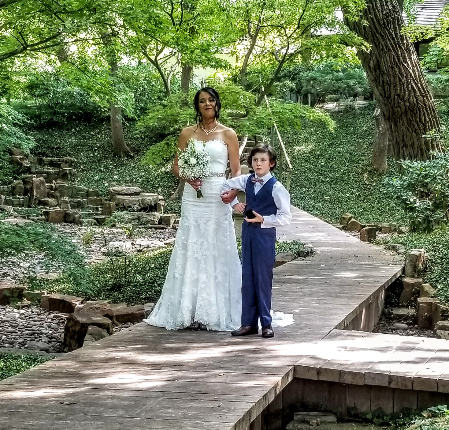 boy walking bride down aisle