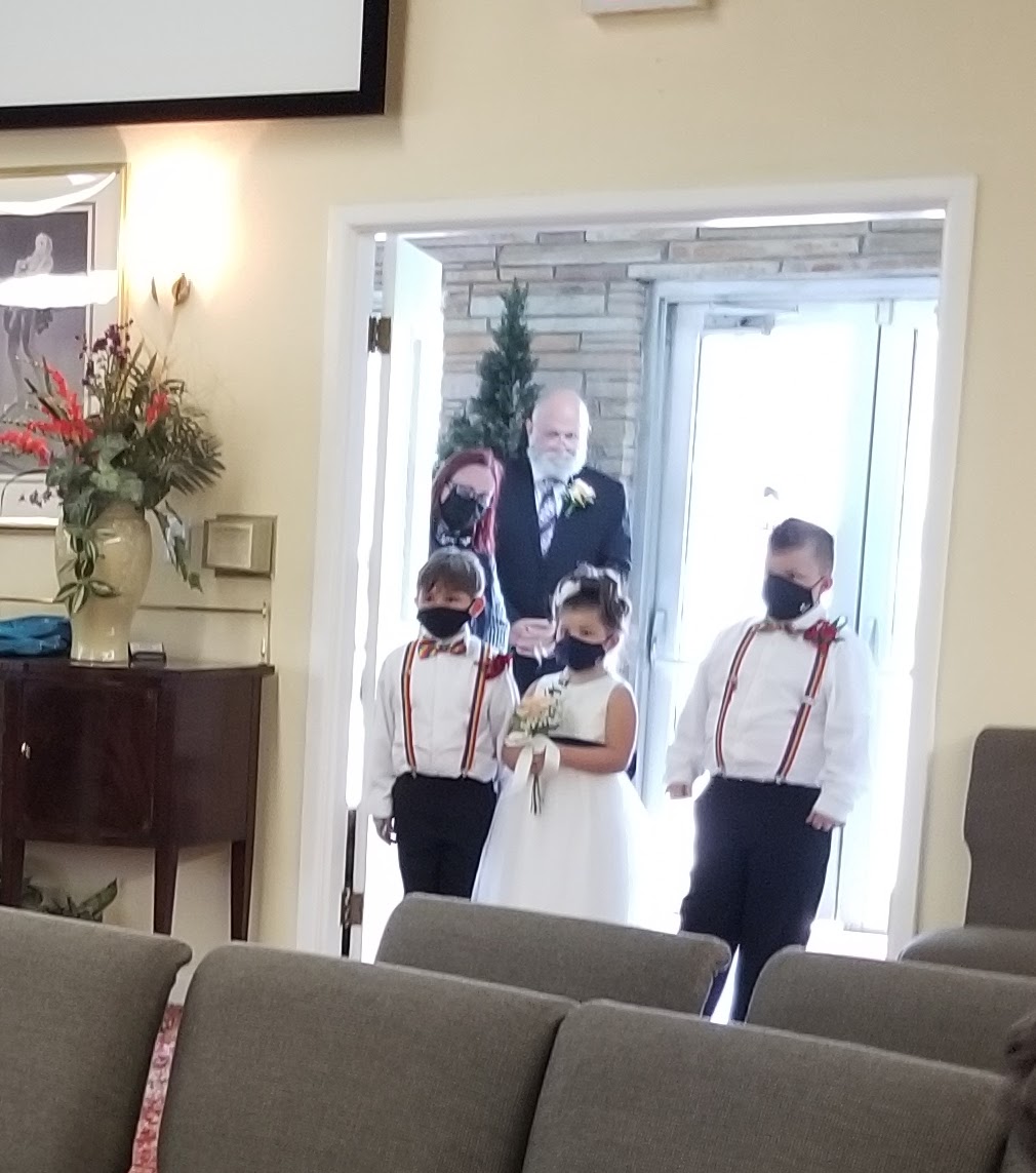ring bearer and flower girl entering church